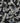 Close-up of small stones in black, white, and gray colors