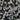 Close-up of small stones in black, white, and gray colors