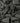 Close-up of dark gray stones and pebbles