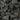 Close-up of dark gray stones and pebbles
