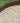 Brown metal landscape border against a grassy background
