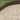 Brown metal landscape border against a grassy background
