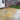 Citron Yellow Limestone Paving; natural golden yellow limestone patio slabs with turf, mixed sized slabs