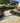 Citron Yellow Limestone Cobble Setts, Calibrated; cobbled outdoor living range garden surface with garden borders and turf