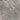 A close-up texture of a gray stone or concrete surface with natural mottled patterns and subtle variations in tone.