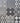 A 3x3 grid of decorative tiles with various black, gray, and white geometric and floral patterns.