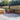 Paved patio area with wooden steps and walls in a garden setting