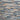Pattern of stacked stone tiles in various shades of gray and brown.