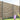 Wooden fence with plants and flowers at the base