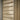 Light natural wood paneling with horizontal slats and a matching vertical wood frame, shown in a close-up view.