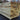 Stack of wooden planks with a blurred outdoor background