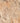 Close-up of a textured stone surface with brown and beige tones
