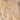 Close-up of a textured stone surface with brown and beige tones