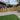 Backyard with wooden pine sleeper steps, gravel area, and grass patch