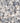 Close-up of small pebbles in various shades of gray, white, and beige.