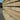 Stack of wooden Prime Oak Sleeper 2.4m x 200mm x 100mm on a concrete surface with a blurred background