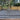 Paved patio area with a tree and wooden fence in the background