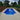 Rectangular pool in a backyard with lounge chairs and greenery
