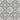 Gray and white repeating decorative tile pattern with ornate scrollwork and floral motifs.