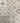 A grid of nine square tiles showcasing various geometric and floral patterns in shades of beige, gray, and brown.