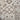A close-up view of decorative ceramic or porcelain floor tiles arranged in a grid, featuring various traditional European-style patterns in shades of beige, taupe, and gray.