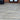Woodland Pine Wood-Effect Porcelain Paving Planks back garden artificial grass; outdoor living area and shed