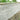 umbra kandla grey Stone wall with garden plants at the top
